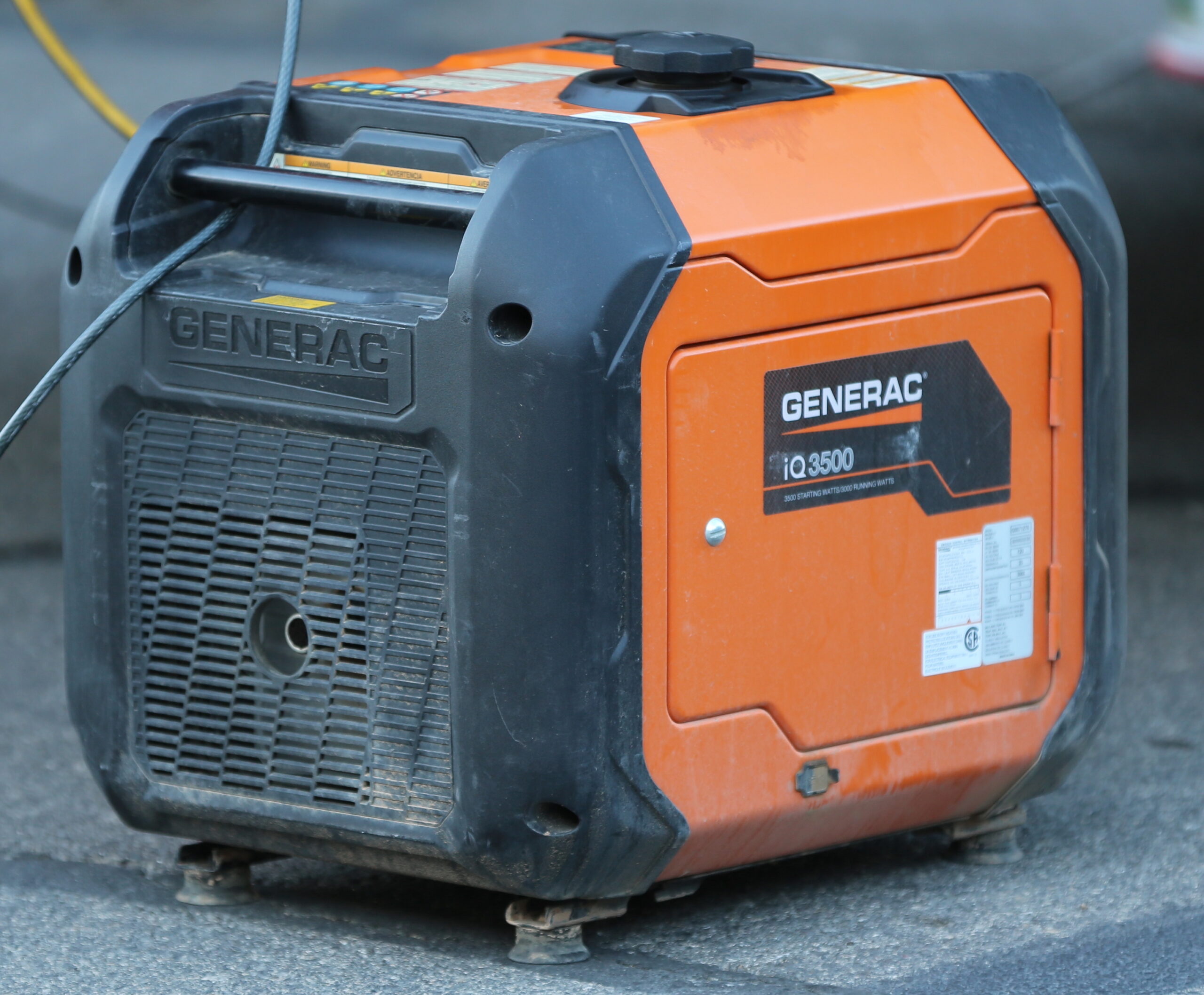 Portable inverter generator on a driveway